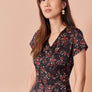 Robe Éléonore fleuri rouge fond noir par Cherry Bobin