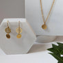 Boucles d'oreilles dollar de mer courtes or de Roxy Lama