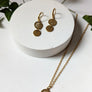 Boucles d'oreilles dollar de mer courtes or de Roxy Lama